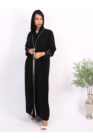 An abaya with a striped pattern at the sides of the hands and at the back