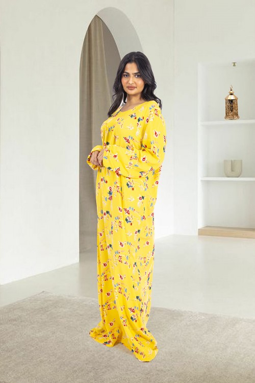 قميص روز نسائي طويل لون أصفر بطبعات ورود كامل أكمام طويلة مزمومة وفتحة صدر دائرية بزم خفيف بشكل مثلث من الأمام