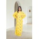 قميص روز نسائي طويل لون أصفر بطبعات ورود كامل أكمام طويلة مزمومة وفتحة صدر دائرية بزم خفيف بشكل مثلث من الأمام