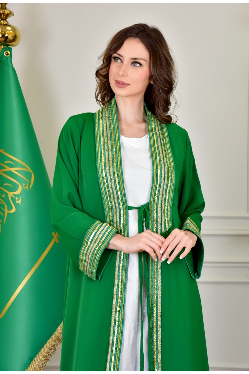 بشت وطني نسائي أنيق لون أخضر قماش شيفون بأطراف مطرزة باللون الفضي أكمام قصيرة و مفتوح برباط من الأمام