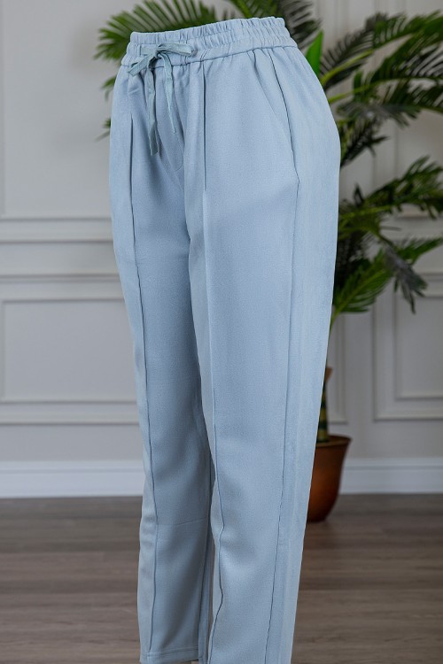 بنطلون شتوي أنيق قماش مخمل لون سماوي بجيوب من الجوانب و الخلف و خصر مطاط برباط من الأمام