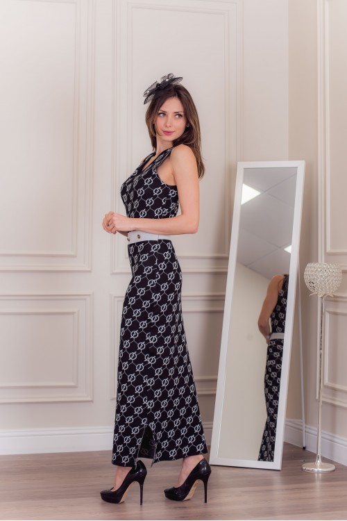 فستان شتوي نسائي أنيق بدون أكمام لون أسود وأبيض وأزرار ذهبية من الخصر