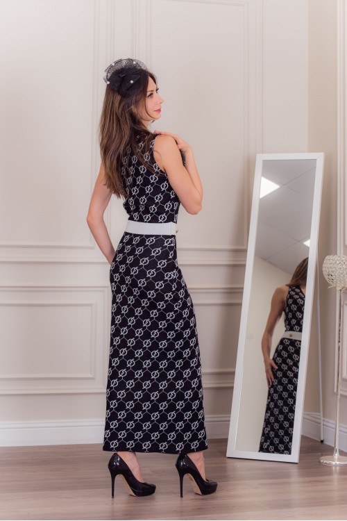 فستان شتوي نسائي أنيق بدون أكمام لون أسود وأبيض وأزرار ذهبية من الخصر