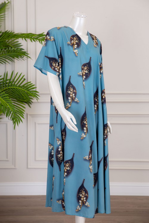 قميص نسائي كلوش لون سماوي بطبعة ورق الشجر و الزهور بياقة قصة سبعة ذو أكمام قصيرة