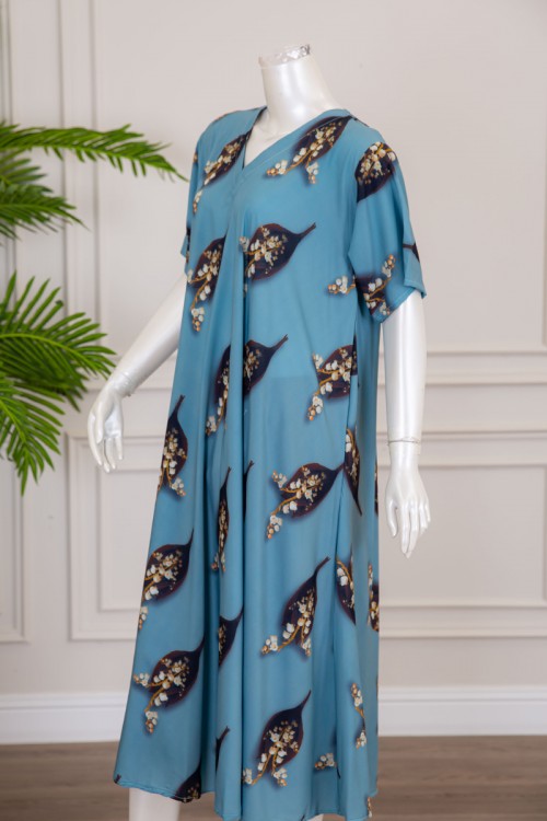 قميص نسائي كلوش لون سماوي بطبعة ورق الشجر و الزهور بياقة قصة سبعة ذو أكمام قصيرة