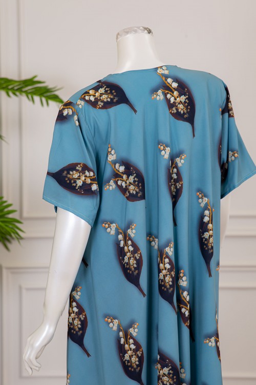 قميص نسائي كلوش لون سماوي بطبعة ورق الشجر و الزهور بياقة قصة سبعة ذو أكمام قصيرة