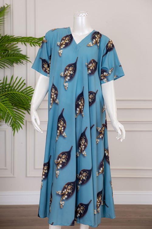 قميص نسائي كلوش لون سماوي بطبعة ورق الشجر و الزهور بياقة قصة سبعة ذو أكمام قصيرة