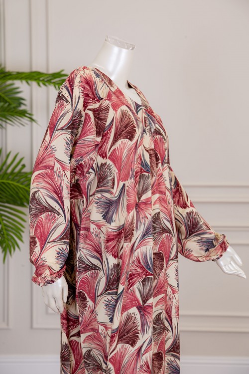 قميص نسائي طويل لون بيج فاتح بطبعات ملونة و بياقة قصة سبعة ذو أكمام طويلة