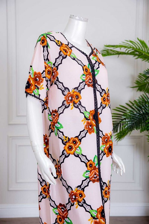 قميص نسائي طويل لون بيج بياقة دائرية مزين بورود ملونة ذو أكمام قصيرة