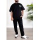 طقم رجالي قطعتين لون أسود تيشيرت بكتابات و طبعات مع بنطلون طويل بجيوب من الجانبين