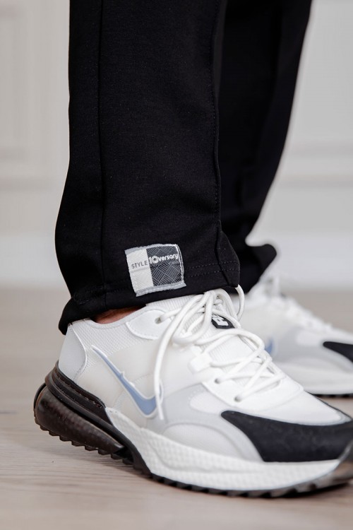 طقم رجالي قطعتين لون أسود تيشيرت بكتابات و طبعات مع بنطلون طويل بجيوب من الجانبين