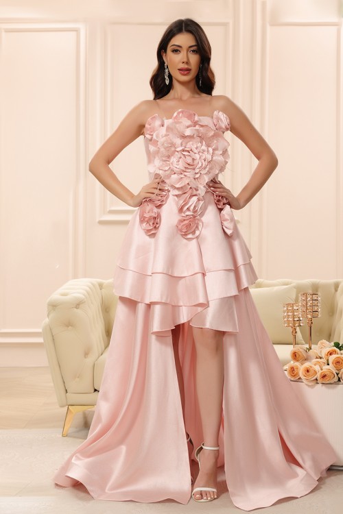 فستان نسائي لون وردي بدون أكمام قصير من الأمام و ذيل طويل من الخلف مزين بالورود