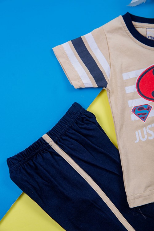 طقم ولادي قطعتين تيشيرت لون بيج مزين بكتابات و رسومات من الأمام مع بنطلون طويل لون كحلي