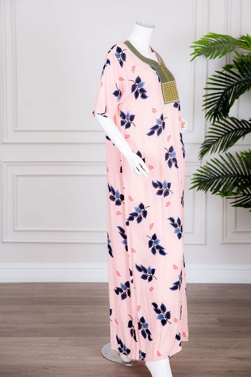 قميص نسائي طويل لون خربزي بطبعات أوراق الشجر و بياقة كلفة مطرزة ذو أكمام قصيرة