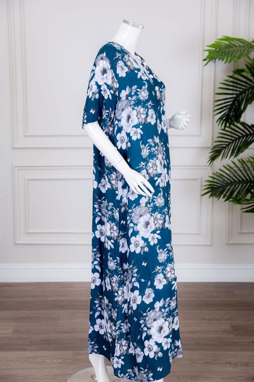 قميص نسائي طويل لون أزرق مزين بالورود ياقة دائرية بأزرار من الأمام ذو أكمام قصيرة