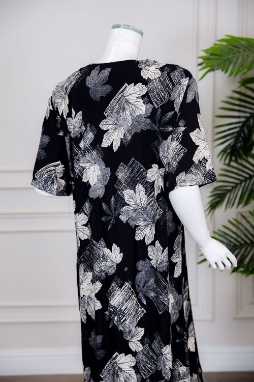 قميص نسائي طويل لون أسود بطبعات أوراق الشجر و بياقة كلفة مطرزة ذو أكمام قصيرة