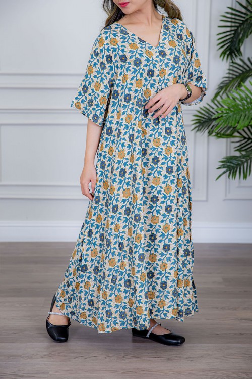 قميص نسائي لون بيج مزين بالورود الملونة ياقة قصة سبعة و أكمام ميدي