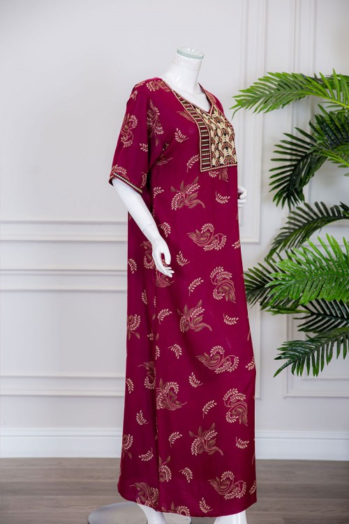 قميص نسائي طويل لون عودي مزين برسومات و بياقة كلفة مطرزة ذو أكمام ميدي