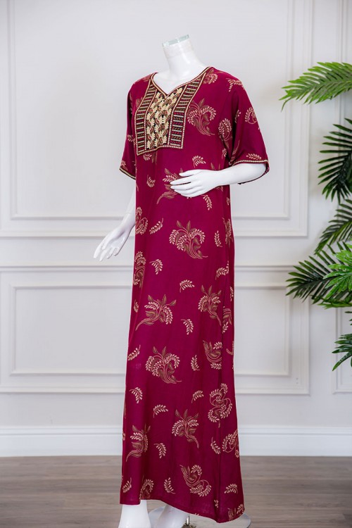 قميص نسائي طويل لون عودي مزين برسومات و بياقة كلفة مطرزة ذو أكمام ميدي