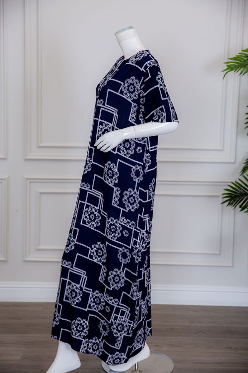 قميص نسائي طويل لون كحلي مزين برسومات مختلفة ياقة دائرية بأزرار من الأمام ذو أكمام قصيرة