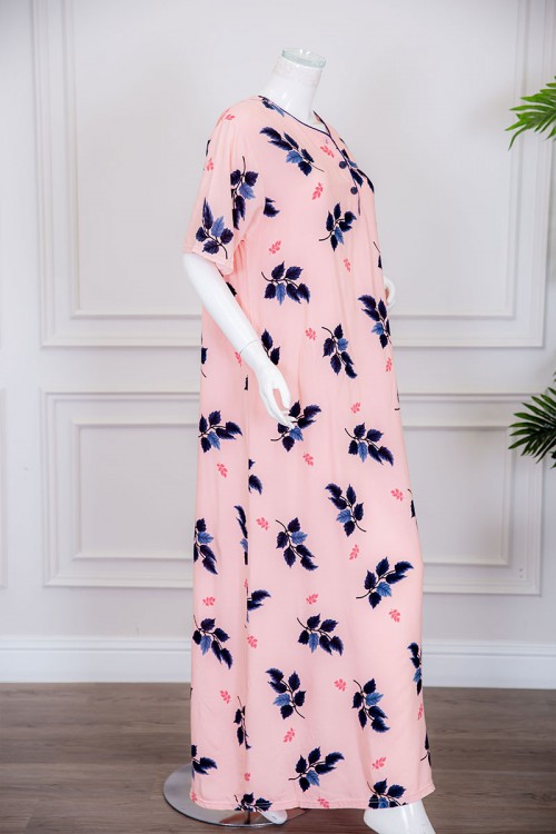 قميص نسائي طويل لون خربزي مزين برسومات أوراق الشجر ياقة دائرية بأزرار من الأمام ذو أكمام قصيرة