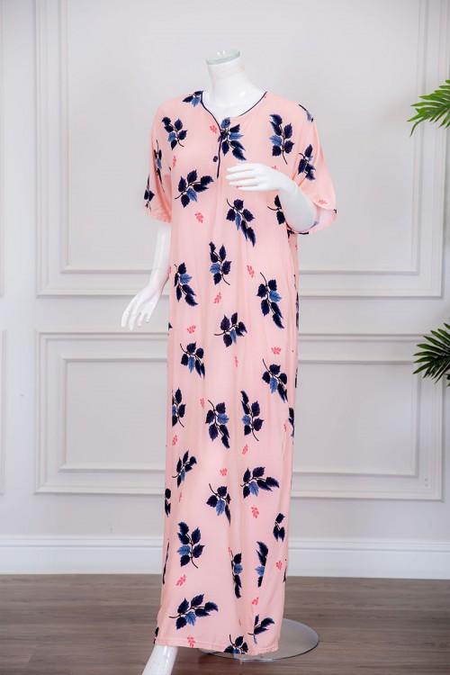 قميص نسائي طويل لون خربزي مزين برسومات أوراق الشجر ياقة دائرية بأزرار من الأمام ذو أكمام قصيرة