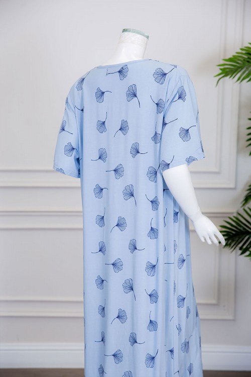 قميص نسائي طويل لون سماوي مزين برسومات ياقة قصة سبعة بخيوط صفراء منسدلة ذو أكمام ميدي