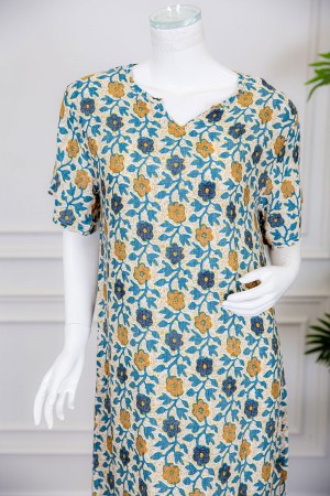 قميص نسائي لون بيج مزين بالورود الملونة ياقة قصة سبعة و أكمام ميدي 