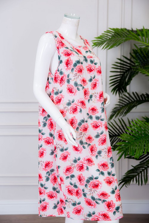 قميص نسائي قصير لون بيج مزين بالورود ياقة دائرية بدون أكمام