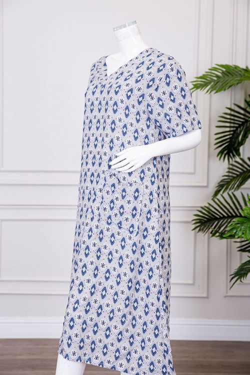 قميص نسائي ميدي مزين بزخارف ياقة قصة سبعة و بجيوب من الأمام ذو أكمام قصيرة