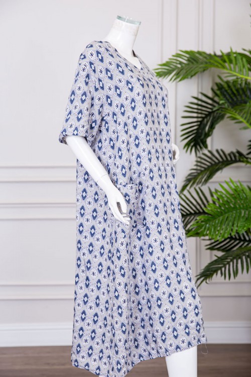 قميص نسائي ميدي مزين بزخارف ياقة قصة سبعة و بجيوب من الأمام ذو أكمام قصيرة