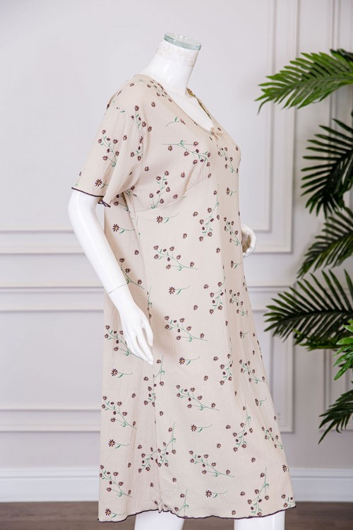 قميص نسائي ميدي لون بيج مشجر ياقة دائرية مزينة بفيونكة و بأكمام قصيرة