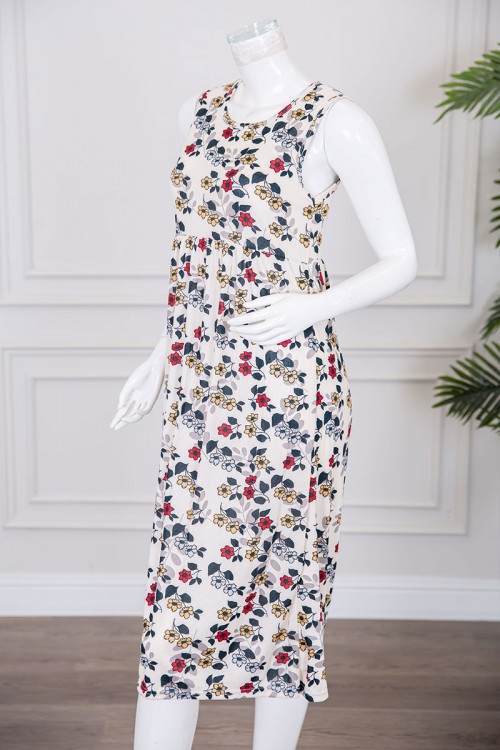 قميص نسائي قصير لون بيج مزين بالورود الملونة ياقة دائرية و بدون أكمام