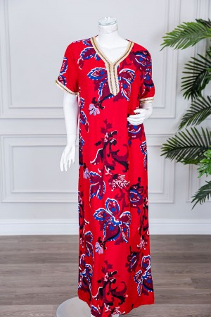 قميص نسائي طويل لون أحمر مزين برسومات ملونة و بكلفة مطرزة في الياقة و الأكمام