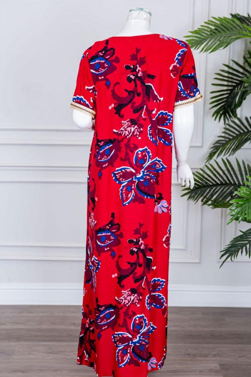 قميص نسائي طويل لون أحمر مزين برسومات ملونة و بكلفة مطرزة في الياقة و الأكمام