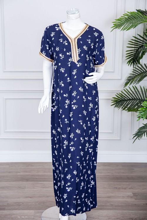 قميص نسائي طويل لون كحلي مزين برسومات و بكلفة مطرزة في الياقة و الأكمام