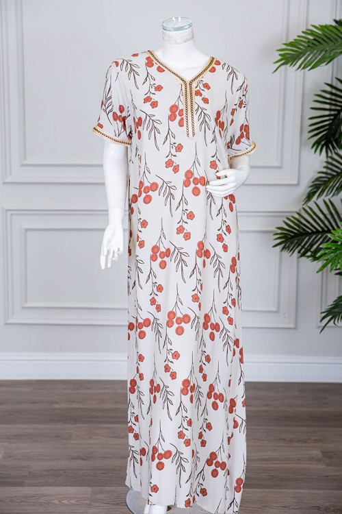 قميص نسائي طويل لون بيج فاتح مزين برسومات و بكلفة مطرزة في الياقة و الأكمام