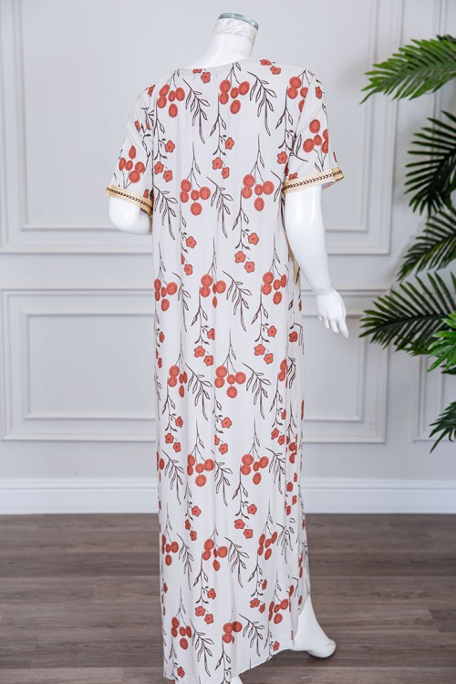 قميص نسائي طويل لون بيج فاتح مزين برسومات و بكلفة مطرزة في الياقة و الأكمام