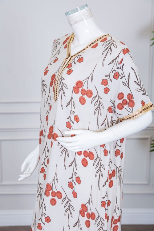 قميص نسائي طويل لون بيج فاتح مزين برسومات و بكلفة مطرزة في الياقة و الأكمام