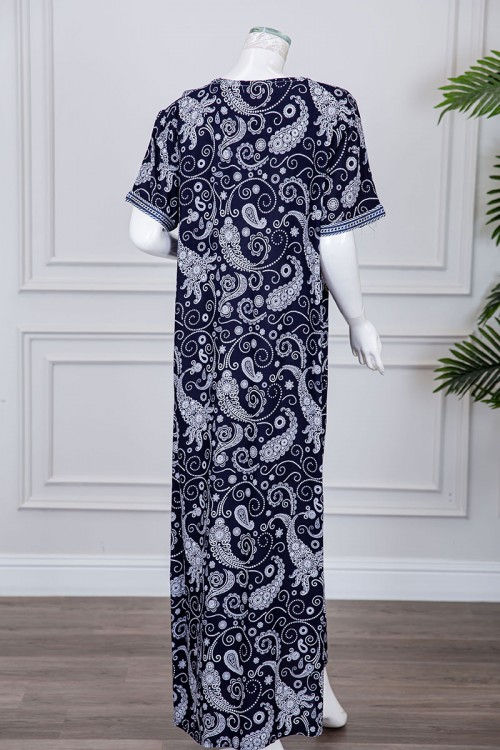 قميص نسائي طويل لون كحلي مزين برسومات و بكلفة مطرزة في الياقة و الأكمام