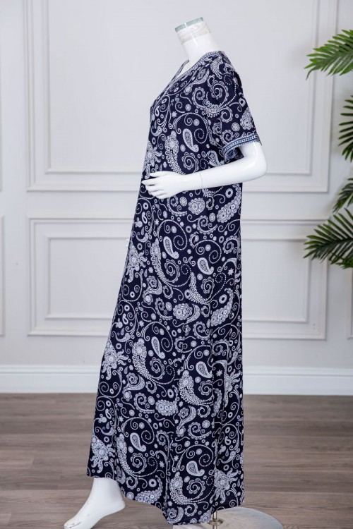 قميص نسائي طويل لون كحلي مزين برسومات و بكلفة مطرزة في الياقة و الأكمام