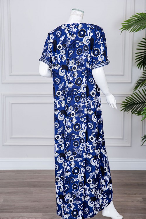 قميص نسائي طويل لون كحلي مزين برسومات و بكلفة مطرزة في الياقة و الأكمام