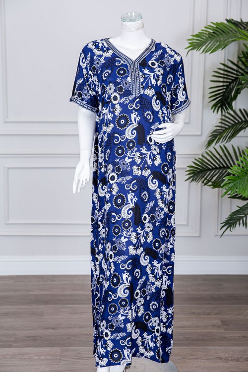 قميص نسائي طويل لون كحلي مزين برسومات و بكلفة مطرزة في الياقة و الأكمام