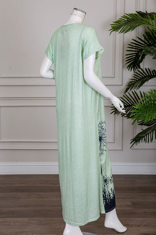 قميص نسائي طويل لون تفاحي مزين برسومات باللون الكحلي ياقة دائرية و أكمام قصيرة