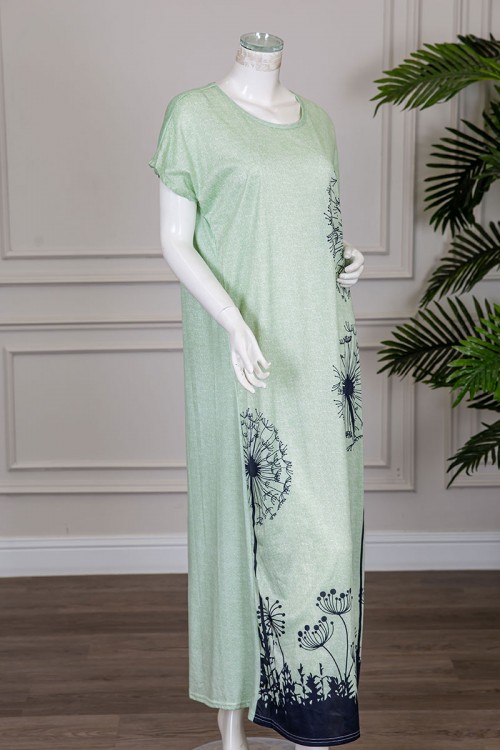 قميص نسائي طويل لون تفاحي مزين برسومات باللون الكحلي ياقة دائرية و أكمام قصيرة