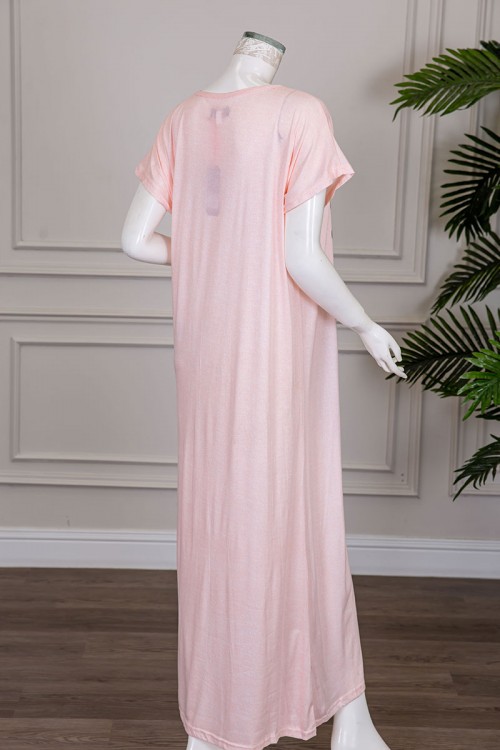 قميص نسائي طويل لون خربزي مزين برسومات بياقة دائرية و أكمام قصيرة