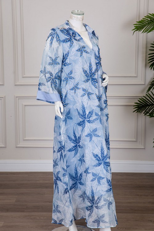 جلابية نسائية لون سماوي مشجرة ياقة قصة سبعة مطوية مزينة بكريستال و بأكمام طويلة