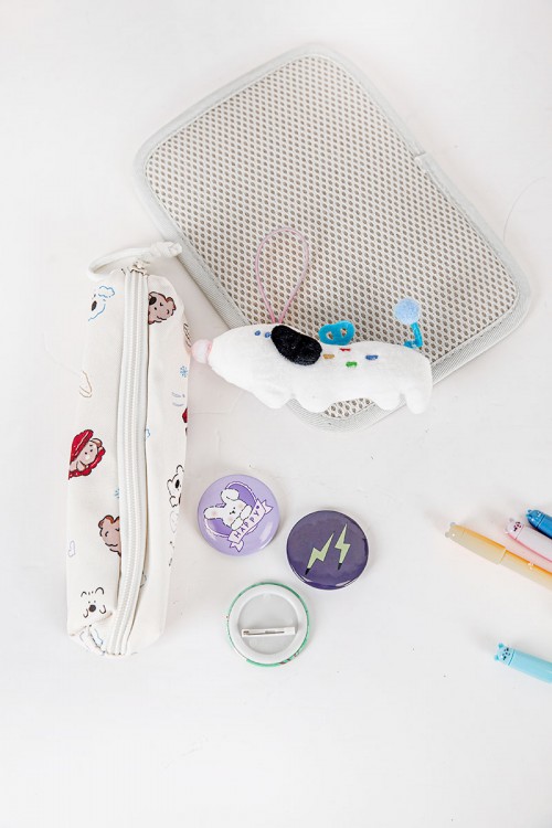 شنطة ظهر مدرسية بناتي لون بيج مزينة برسومات ملونة و بجيوب متعددة مع مقلمة