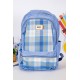 شنطة ظهر مدرسية لون سماوي مزينة بقماش مربعات من الأمام و بجيوب متعددة