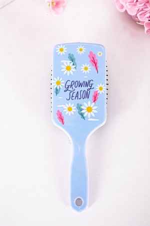 فرشاة شعر لون سماوي مزينة بكتابات و رسومات ملونة